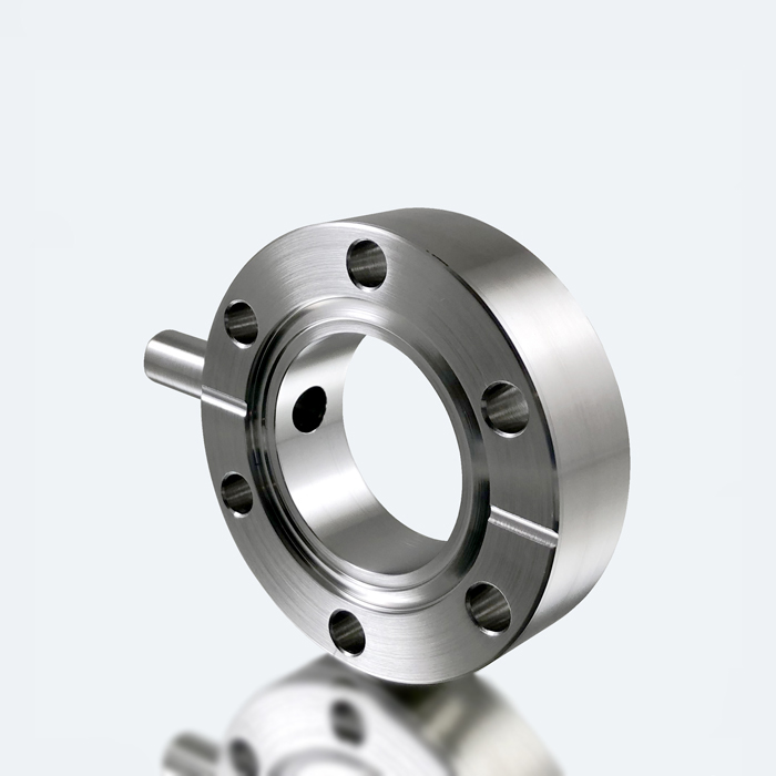 Double sided flange with radial ports